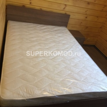 Кровать с тумбой из темного дерева